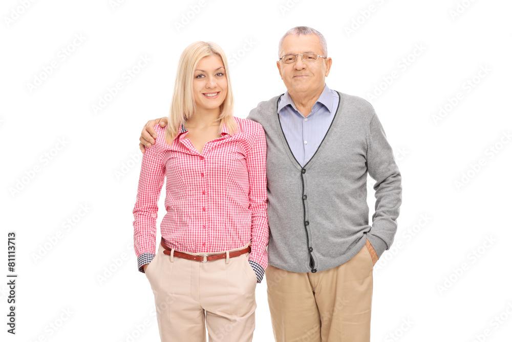 Studio shot of a father and daughter posing hugged Studio shot of a father and daughter posing hugged