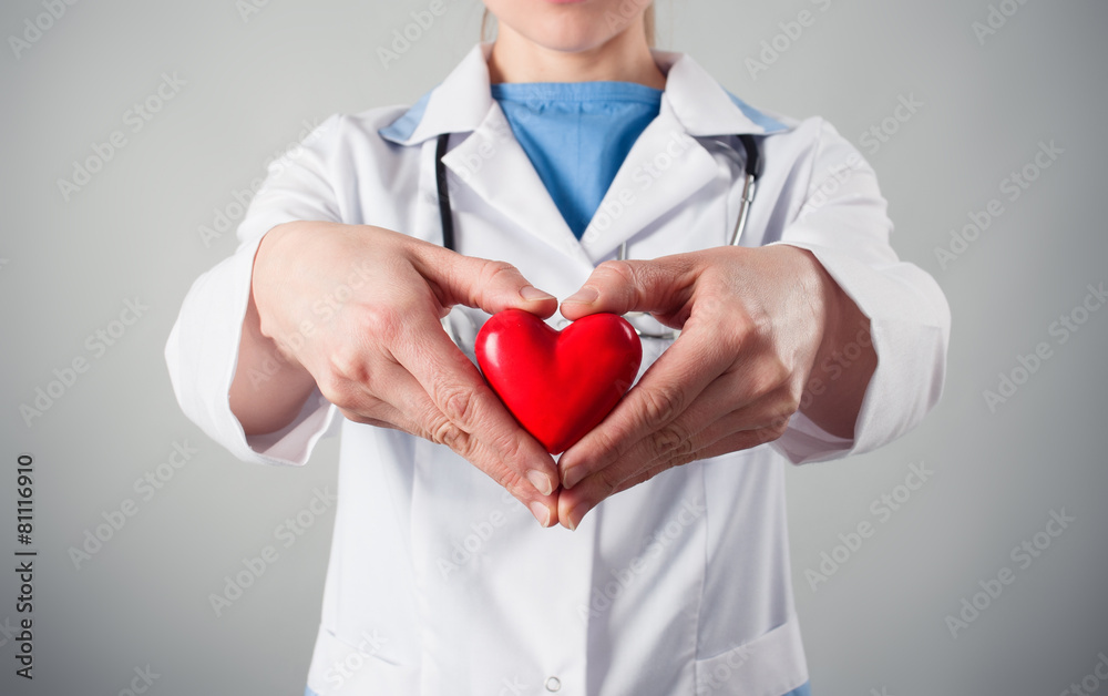 Doctor's hands holding heart shape. Concept of heart protection Doctor's hands holding heart shape. Concept of heart protection