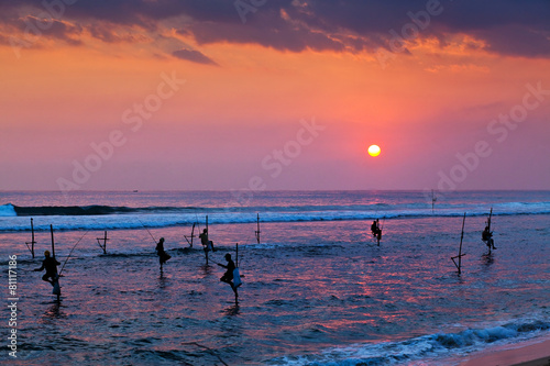 Silhouettes of the traditional stilt fishermen at the sunset nea © Melinda Nagy