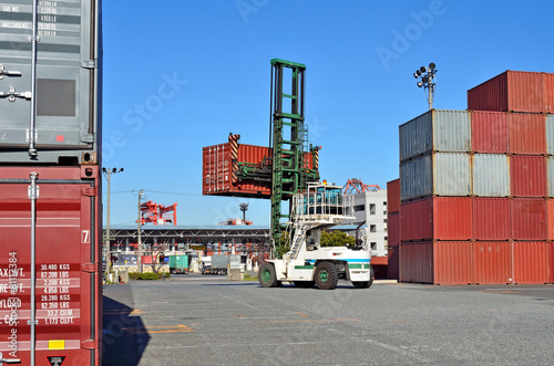 Photography Crane lifting up container in yard, the Port of Tokyo, Japan