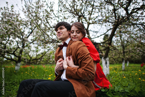 Young beautiful couple in the garden