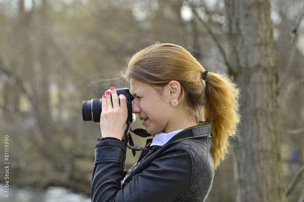 Girl in a black jacket photographs