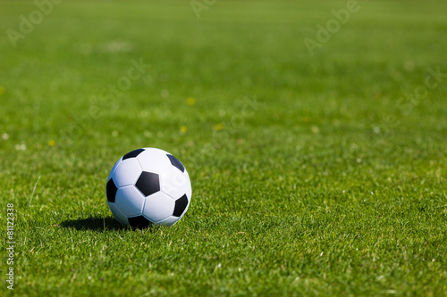 Green pitch with soccer ball