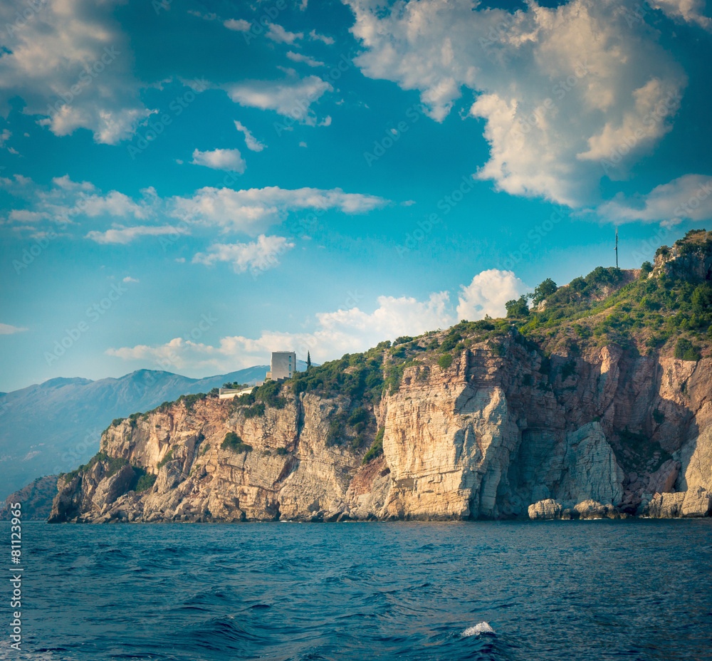 The high cliffs next to the central beach of Budva The high cliffs next to the central beach of Budva