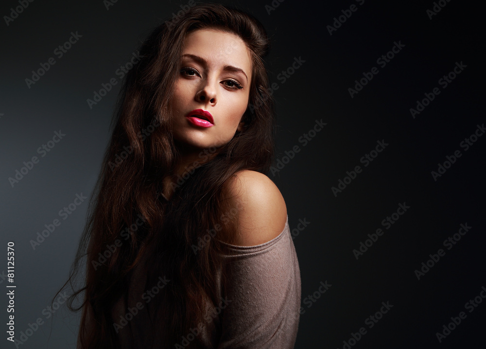 Sexy long hair woman with bright makeup on dark Sexy long hair woman with bright makeup on dark