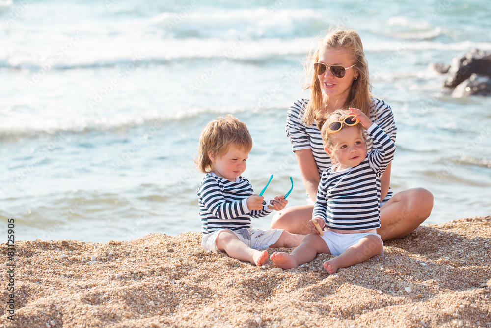 Mother with children on the beach Mother with children on the beach