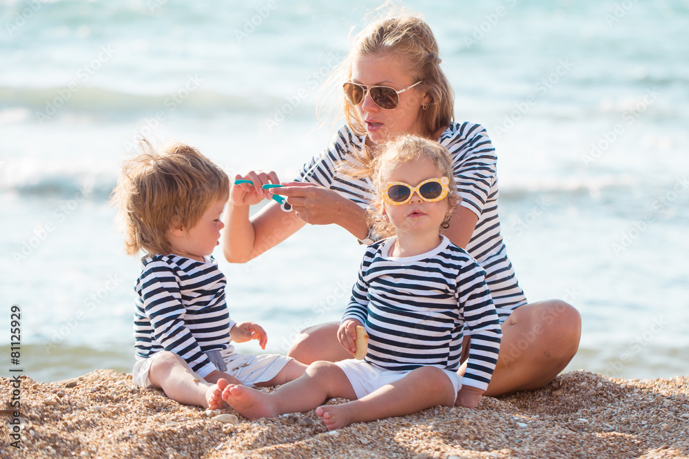 Mother with children on the beach Mother with children on the beach