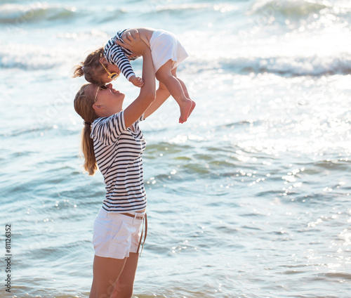 Mother with daughter on the beach