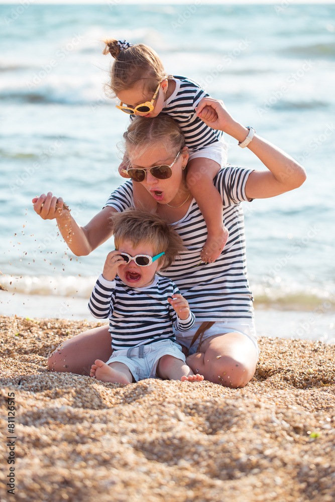 Mother with children on the beach Mother with children on the beach