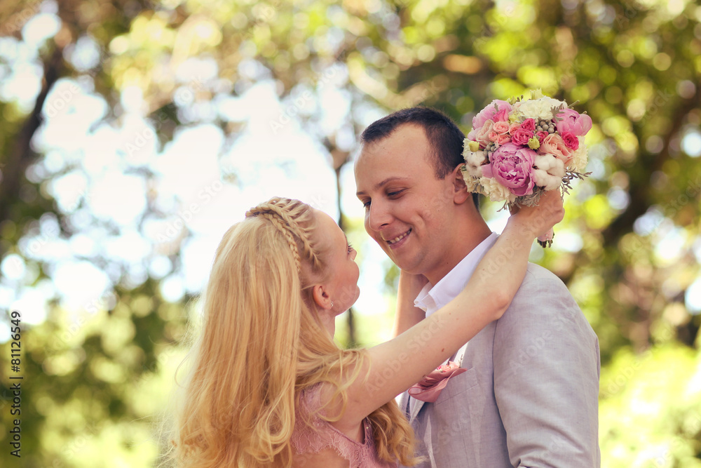 Beautiful couple celebrating in the park Beautiful couple celebrating in the park