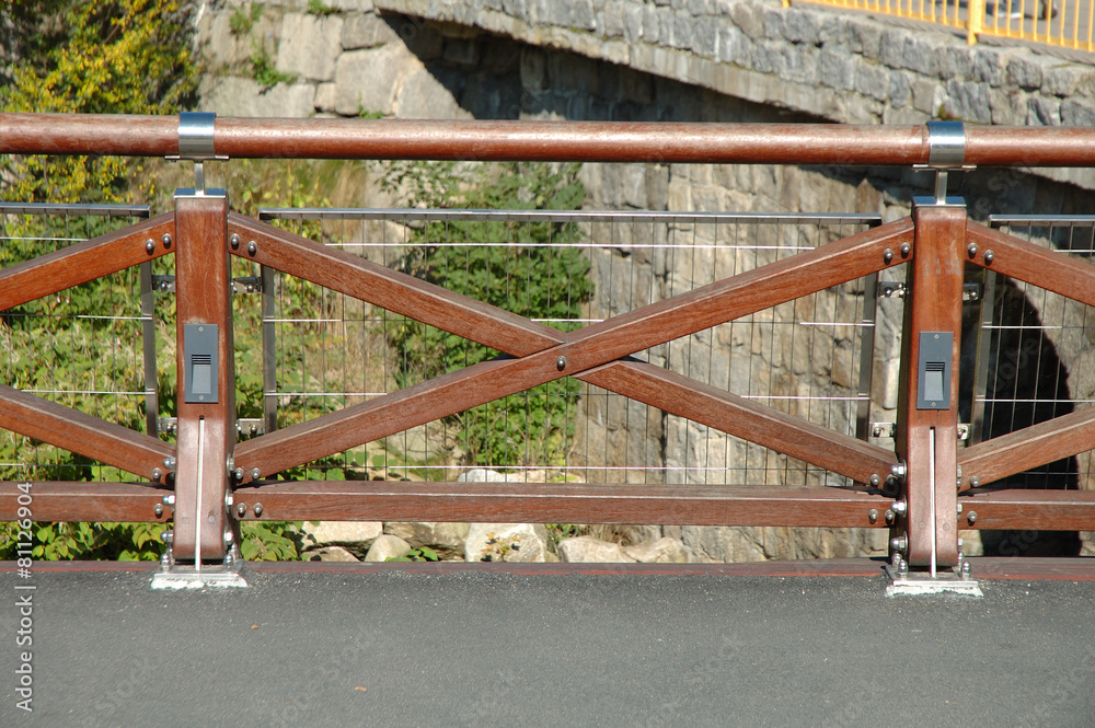 New wooden barrier on bridge