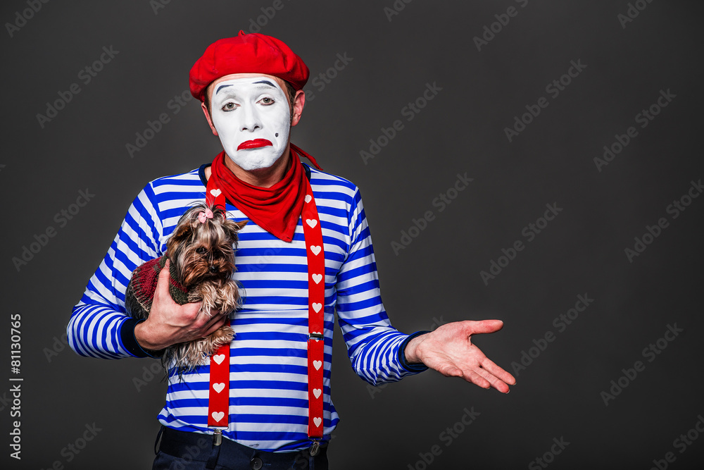 mime hugging her dog and hand gestures