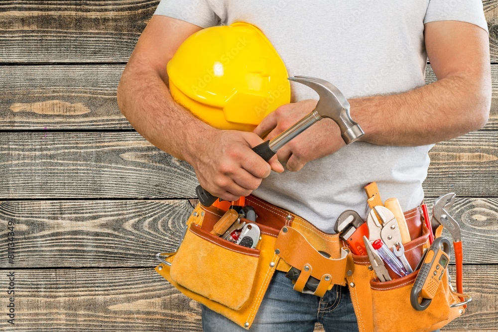 Adjustable. Handyman with a tool belt. House renovation service. Adjustable. Handyman with a tool belt. House renovation service.