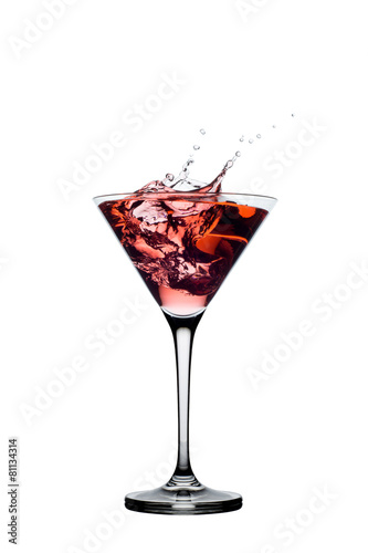 Red cocktail with splashes isolated on white