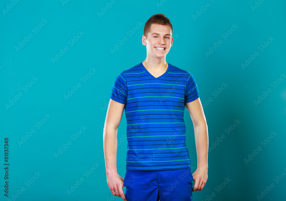 Young smiling man portrait on blue Young smiling man portrait on blue