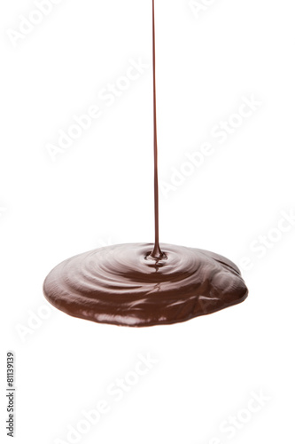 Pouring hot chocolate liquid over white background