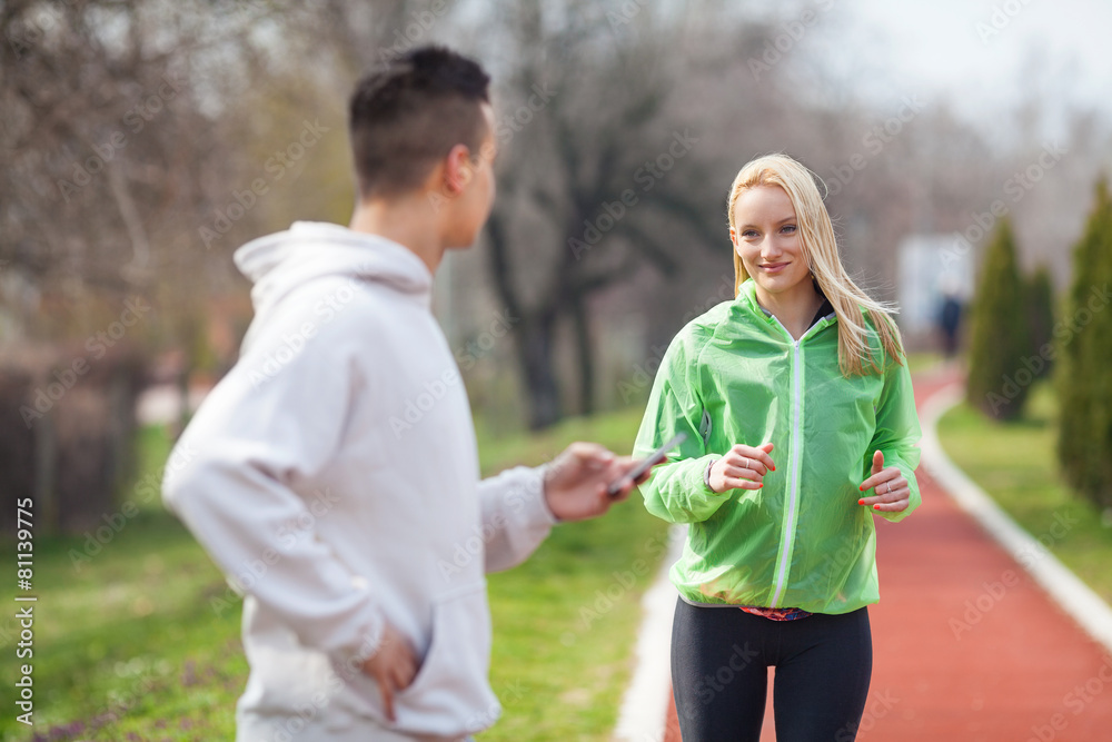 © bokan - Young woman exercising with her coach