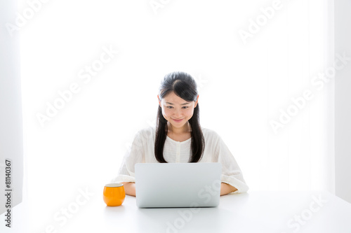 young asian woman using laptop