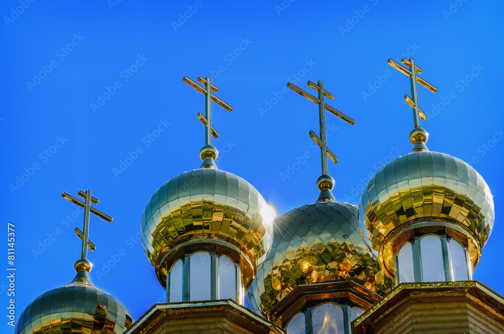 The golden dome on the  wooden russian church