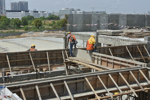 Group of construction worker fabricating beam formwork