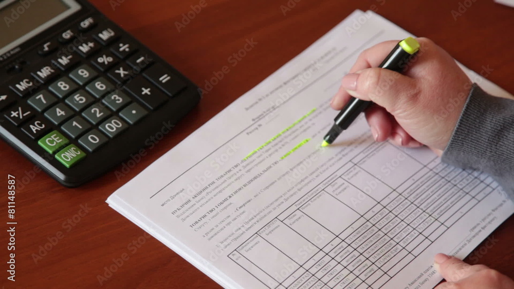 Female hand marker identifies and fills out a form Female hand marker identifies and fills out a form