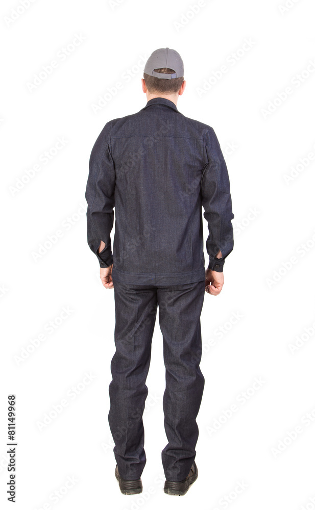 Worker in black workwear. Back view. Worker in black workwear. Back view.