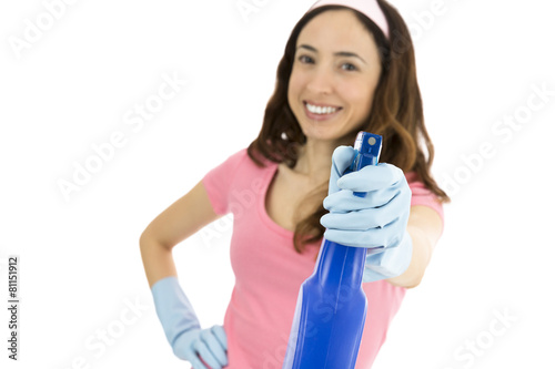 Cleaning woman showing spray bottle