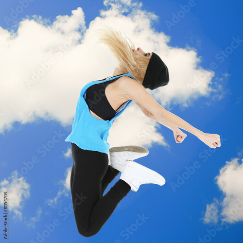 Jumping woman on sky backgr...