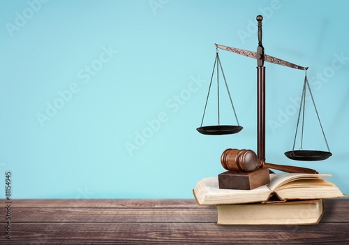 Law. Golden scales of justice, gavel and books isolated on white