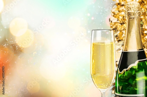 Win. Flutes of champagne in holiday setting