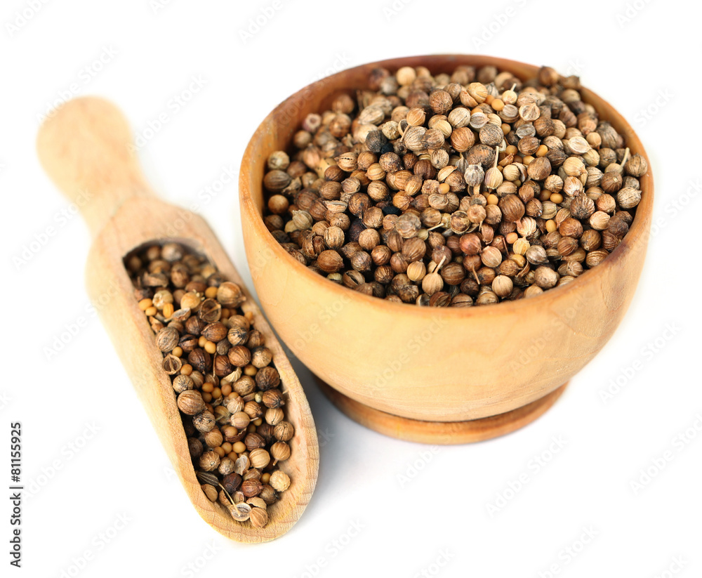 Coriander in wooden bowl, isolated on white Coriander in wooden bowl, isolated on white