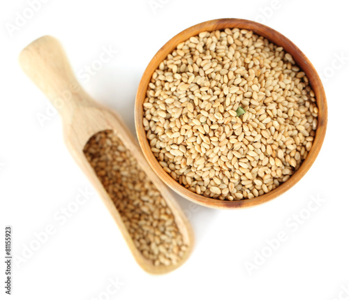 Sesame in wooden bowl, isolated on white