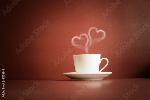 cup of tea with steam in two heart shape