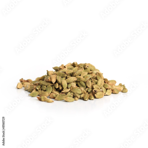 Pile of green cardamom seeds isolated on white background