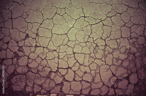 Crack dry soil ground background in vintage color