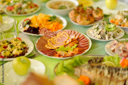 table set service with silverware and glass stemware at restaurant before party