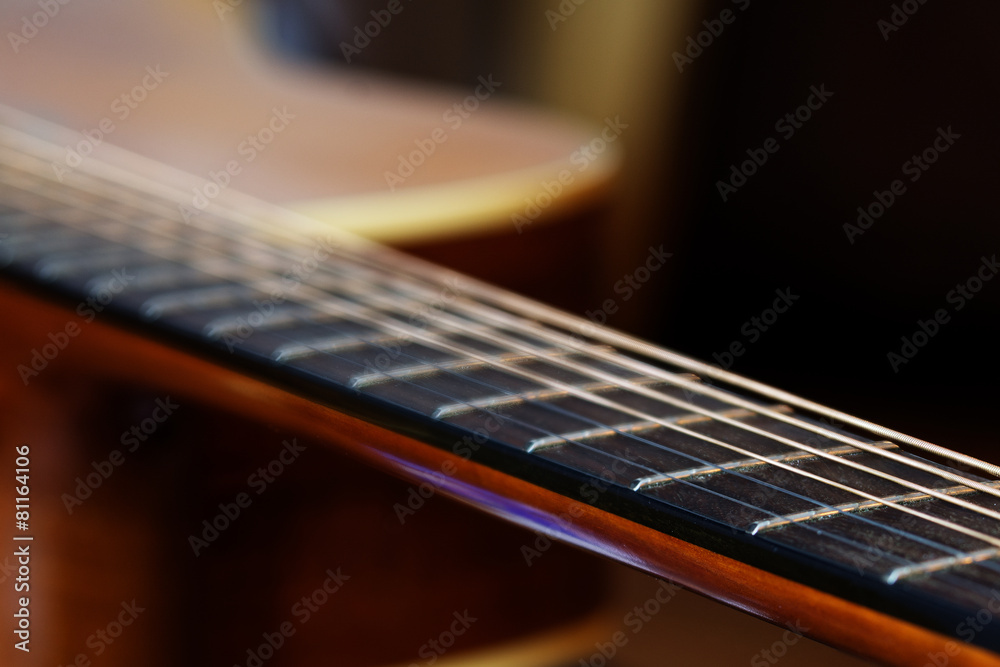 Fototapeta premium guitar fretboard, detail with shallow depth of field