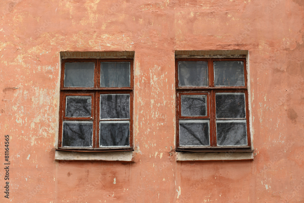 Windows on the wall of an old house Windows on the wall of an old house