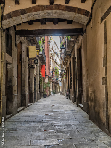 Small street in Barcelona Gothic quarter #81165596