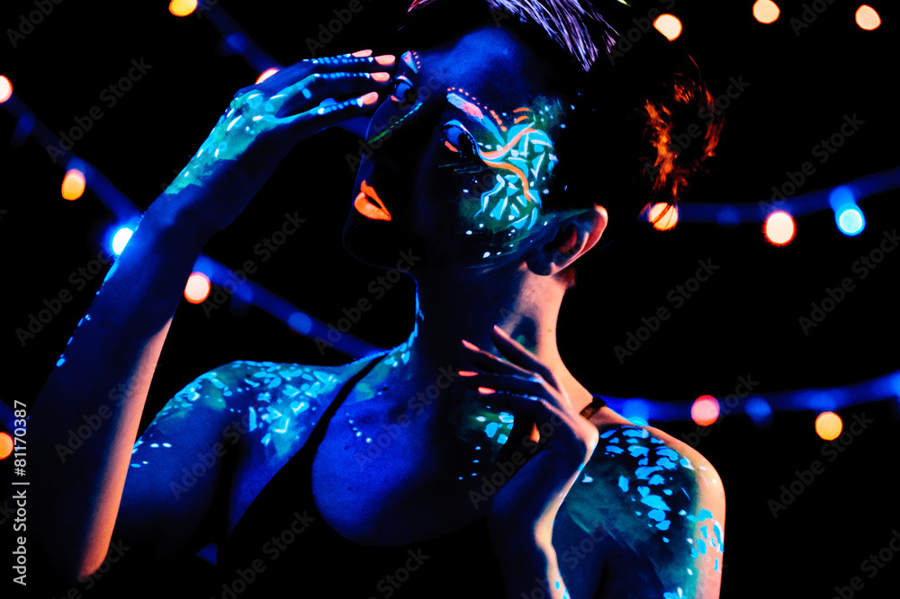Girl with neon paint bodyart portrait, studio shot Girl with neon paint bodyart portrait, studio shot