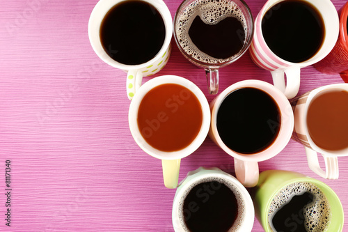 Many cups of coffee on pink background © Africa Studio
