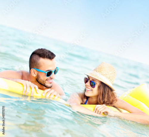 Young couple having fun in the sea