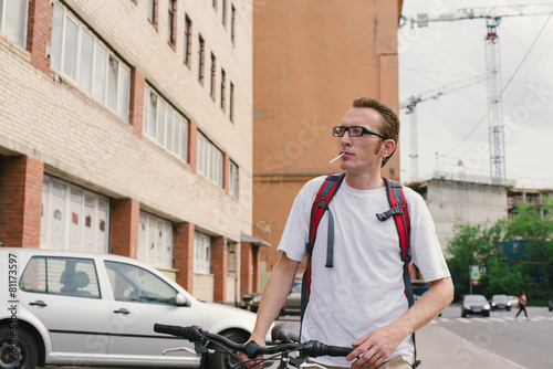 Smoking man in working modern district © vasilisa_k