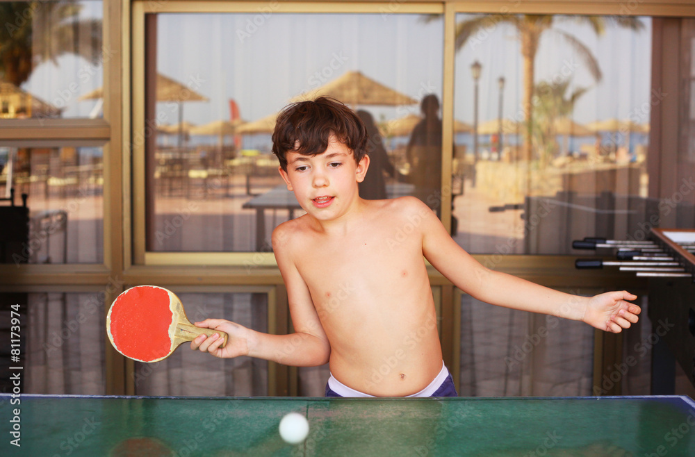 preteen handsome boy play table tennis in the beach resort hotel Stock  Photo | Adobe Stock