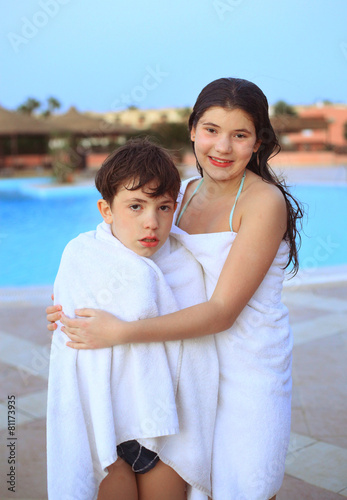 beautiful siblings brother and sister in  towel after swimming i photo