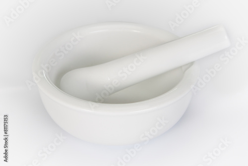 White mortar and pestle on a white background