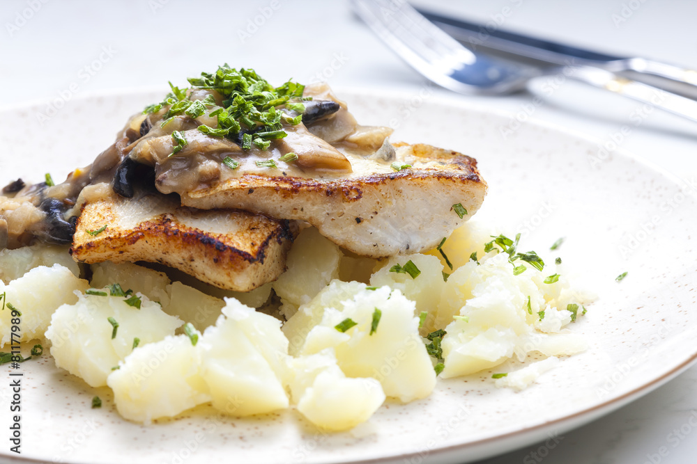 pikeperch on butter with mushroom sauce and spring potatoes pikeperch on butter with mushroom sauce and spring potatoes