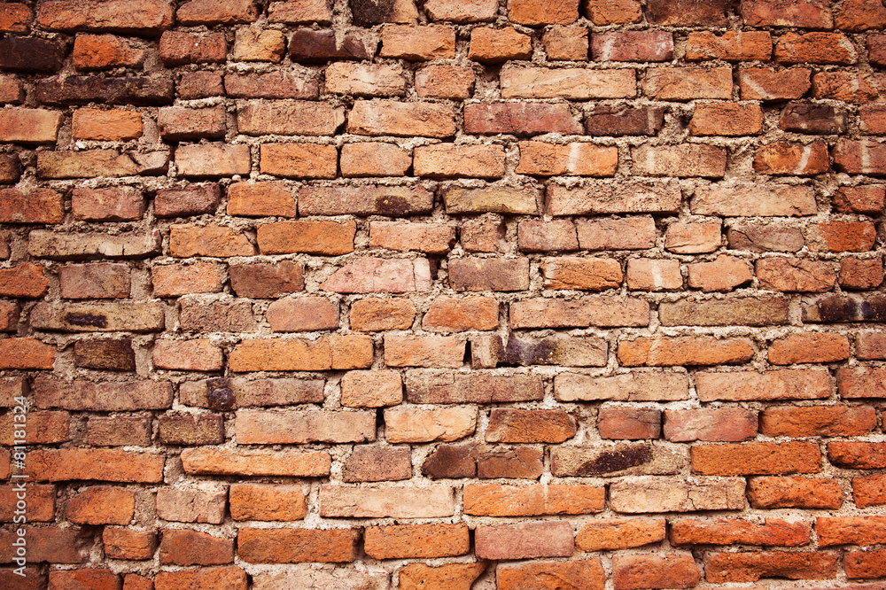 Obraz premium Old empty brick wall background, plaster falling off.