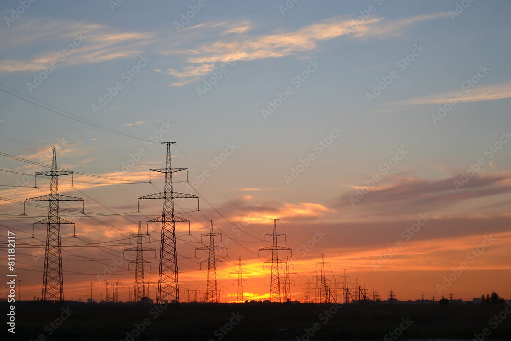 Electric power transmission lines at sunset.