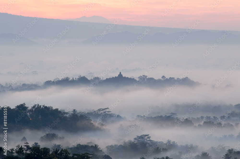 hilltop view of Borobudur in mist